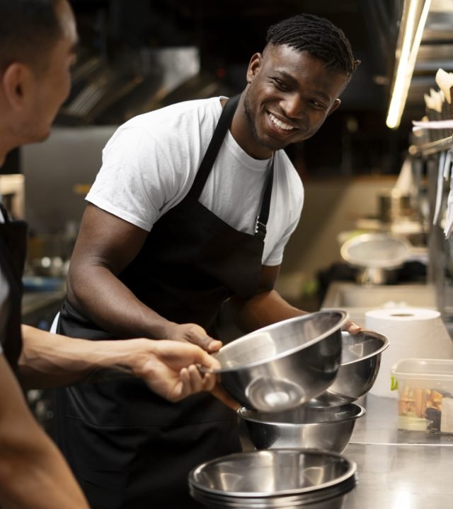 chef-cooking-kitchen-while-wearing-professional-attire